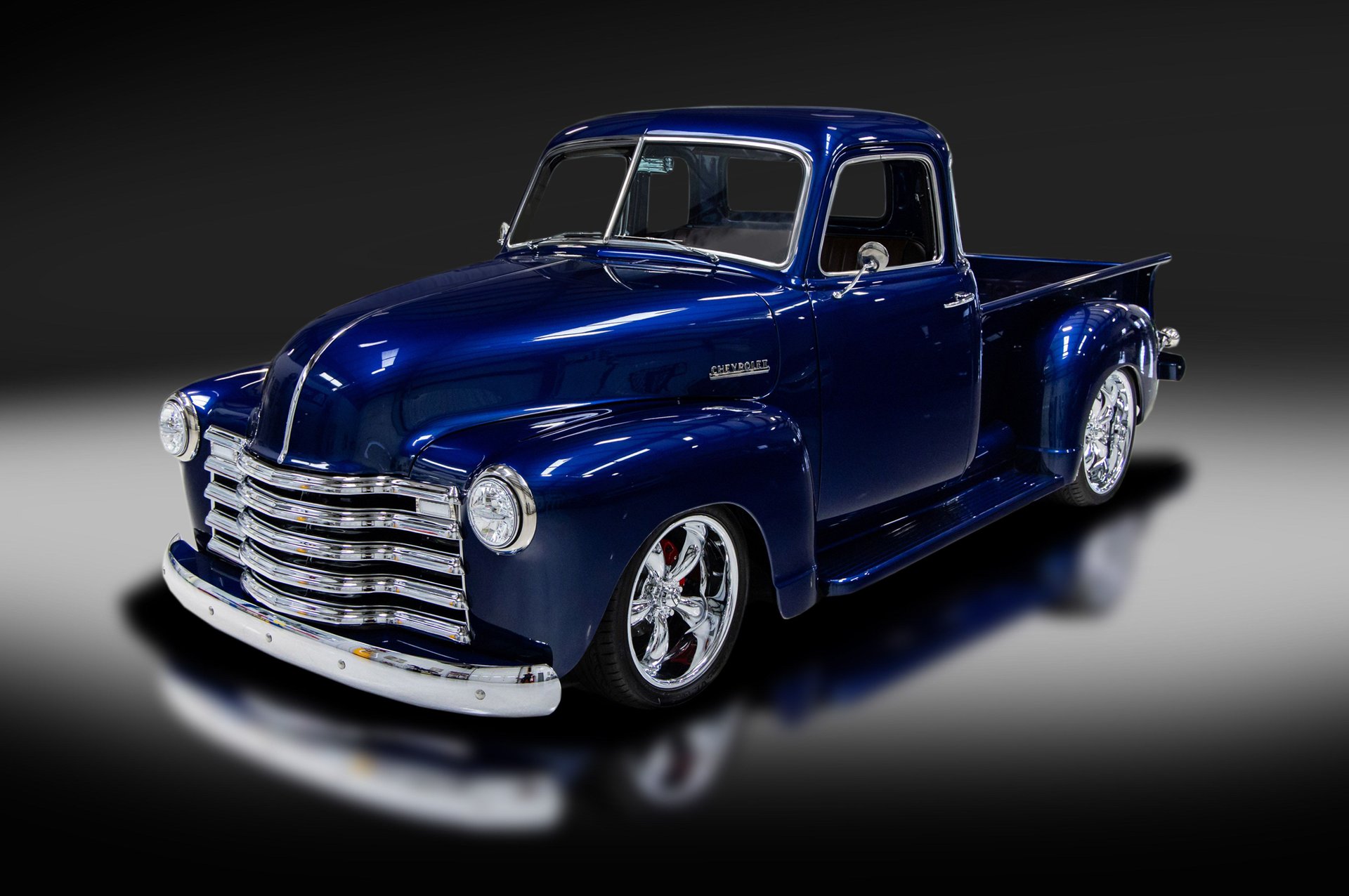 A relevant stock photo of 1951 chevy truck custom in a typical setting.