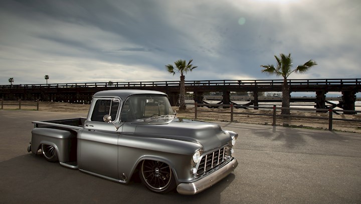 A relevant stock photo of 1956 chevy truck custom in a typical setting.