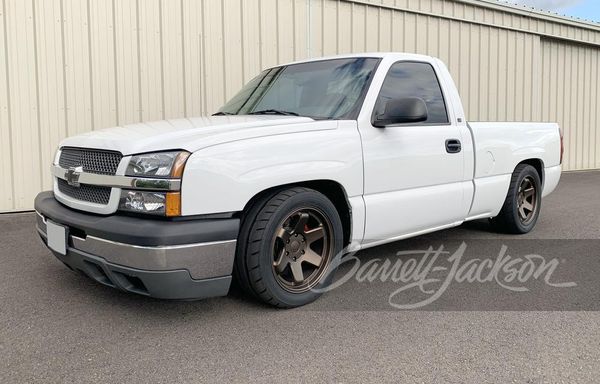 A relevant stock photo of 2003 chevy silverado custom in a typical setting.