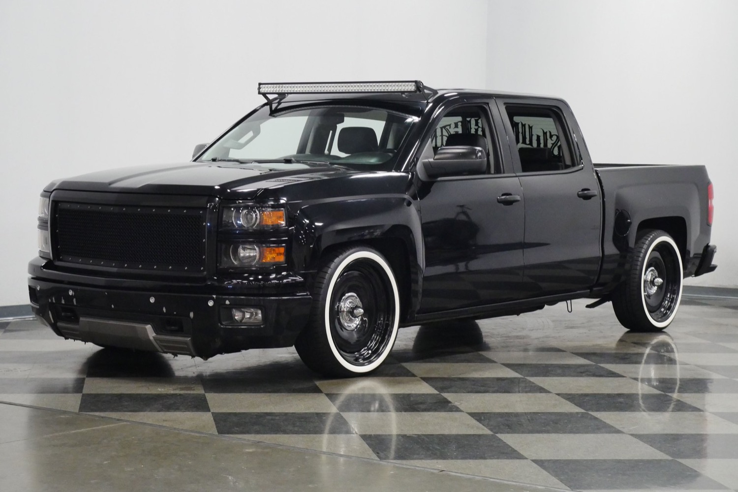 A relevant stock photo of 2014 chevy silverado custom in a typical setting.
