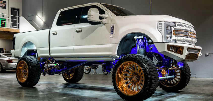 A relevant stock photo of 4x4 truck custom in a typical setting.