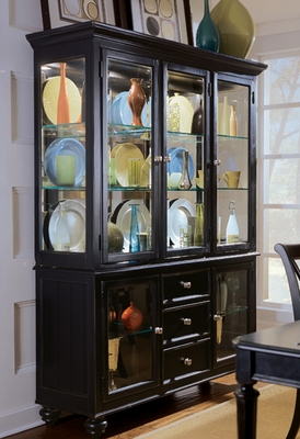 A relevant stock photo of black cabinet china in a typical setting.