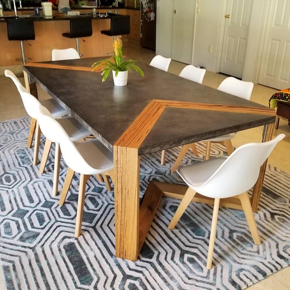 A relevant stock photo of concrete dining table custom in a typical setting.