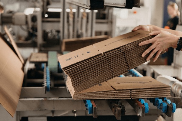 A relevant stock photo of corrugated cardboard manufacturer in a typical setting.