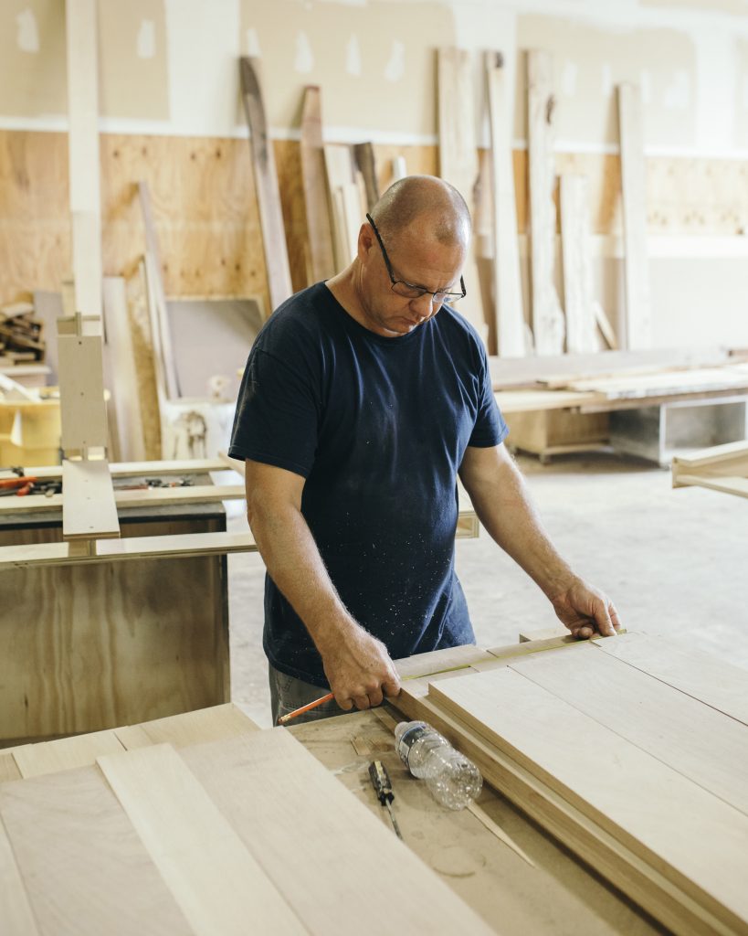 A relevant stock photo of custom furniture maker in a typical setting.