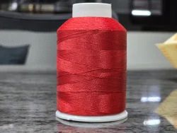 A relevant stock photo of embroidery thread manufacturer in a typical setting.