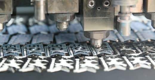 A relevant stock photo of enamel pin manufacturer in a typical setting.