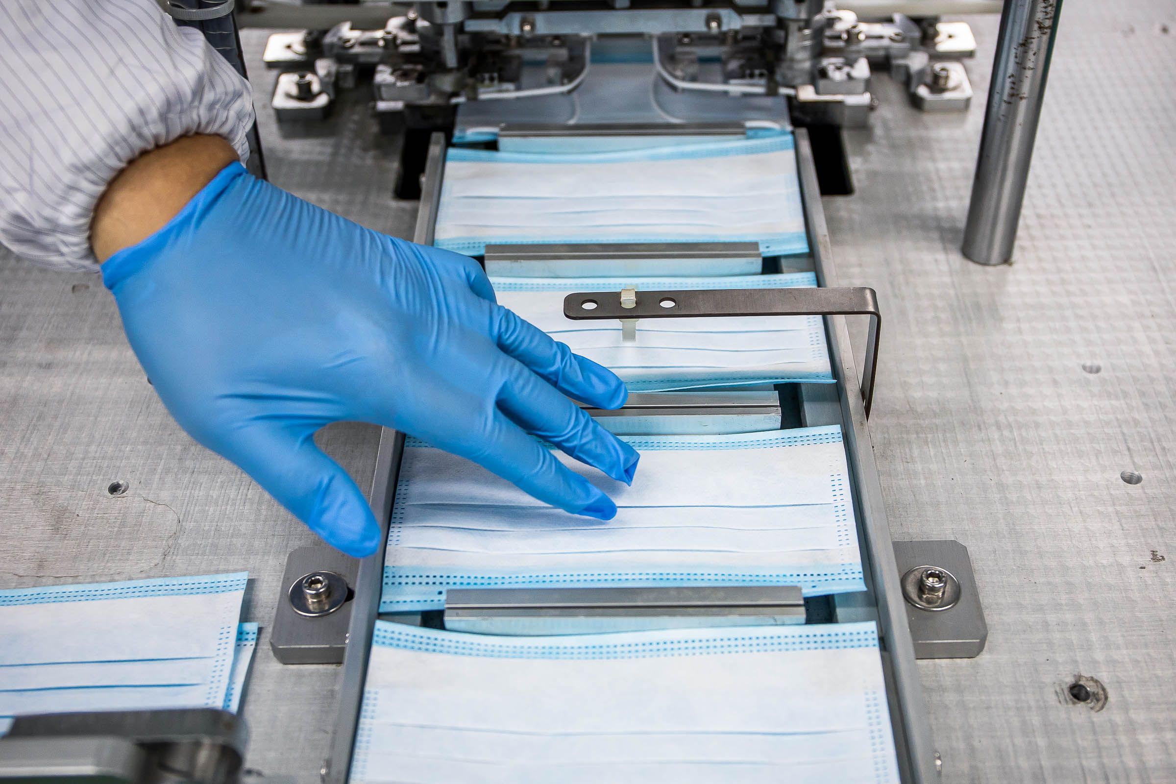 A relevant stock photo of face mask manufacturer in a typical setting.