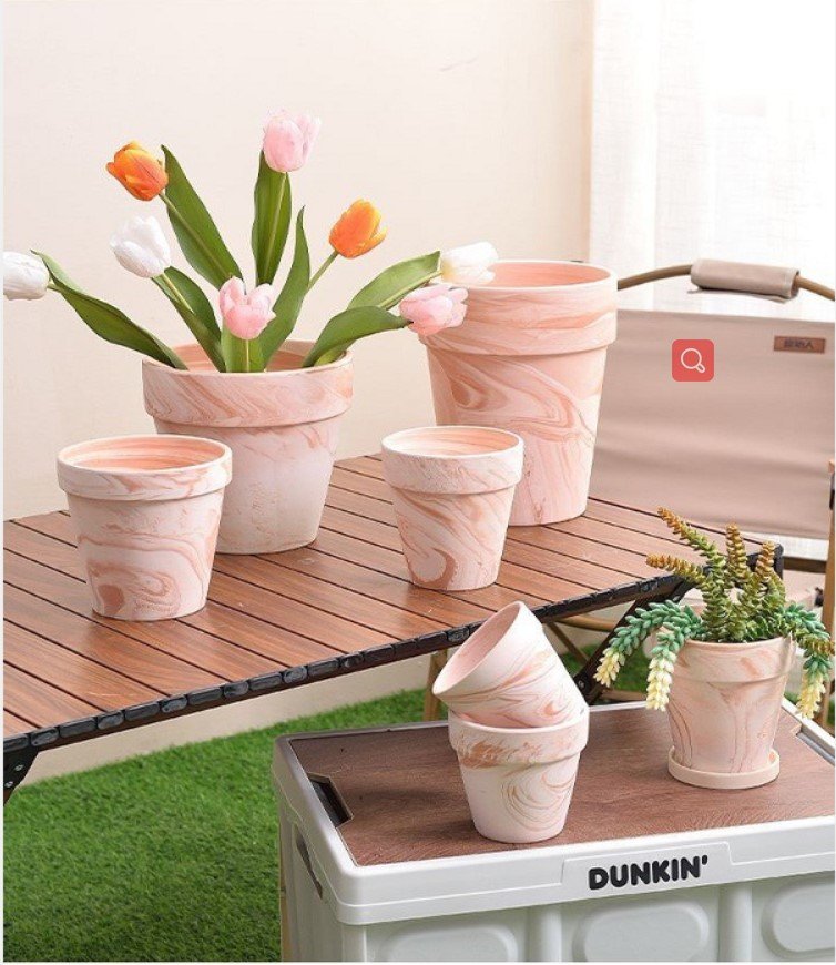 A relevant stock photo of flower pots supplier in a typical setting.