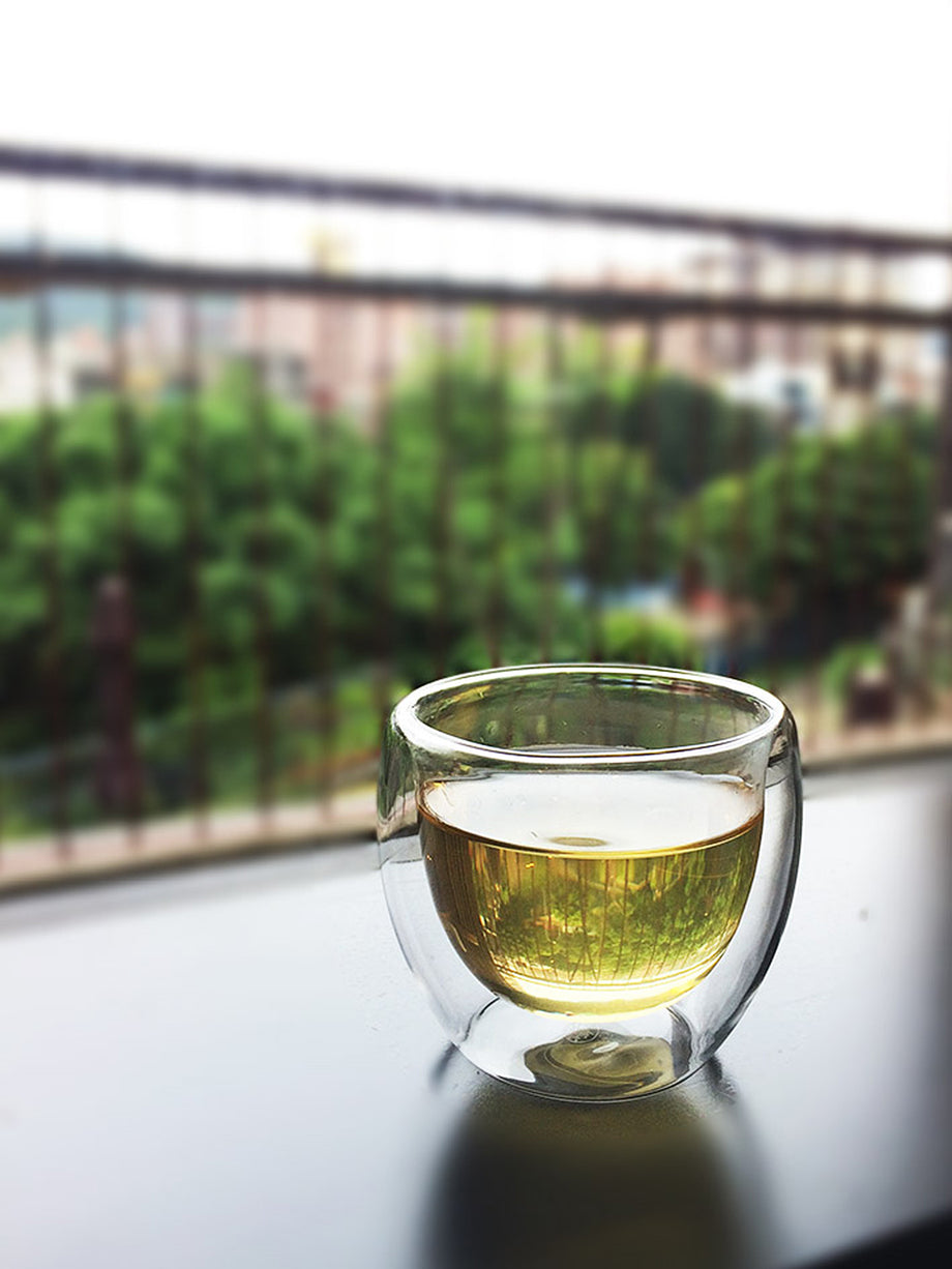 A relevant stock photo of glass cup china in a typical setting.