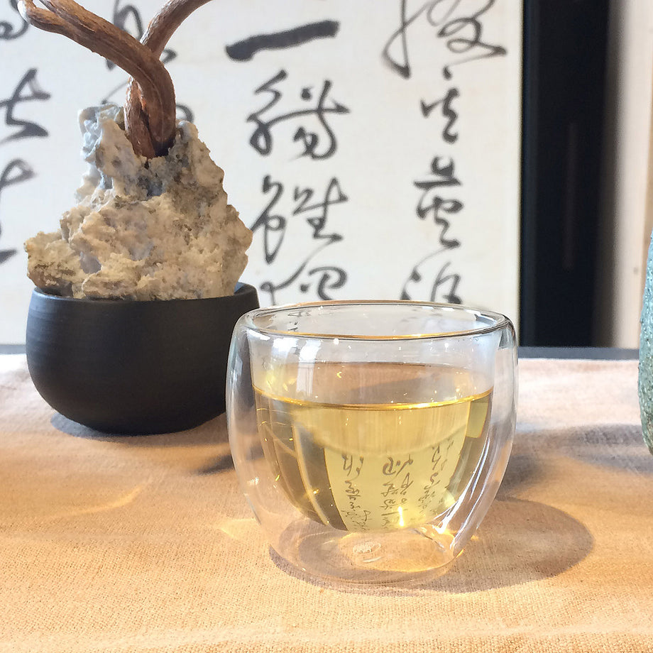 A relevant stock photo of glass cup china in a typical setting.