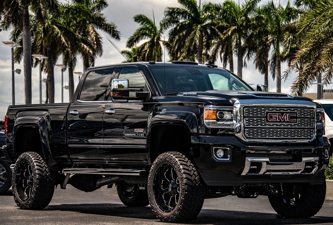A relevant stock photo of gmc denali truck custom in a typical setting.