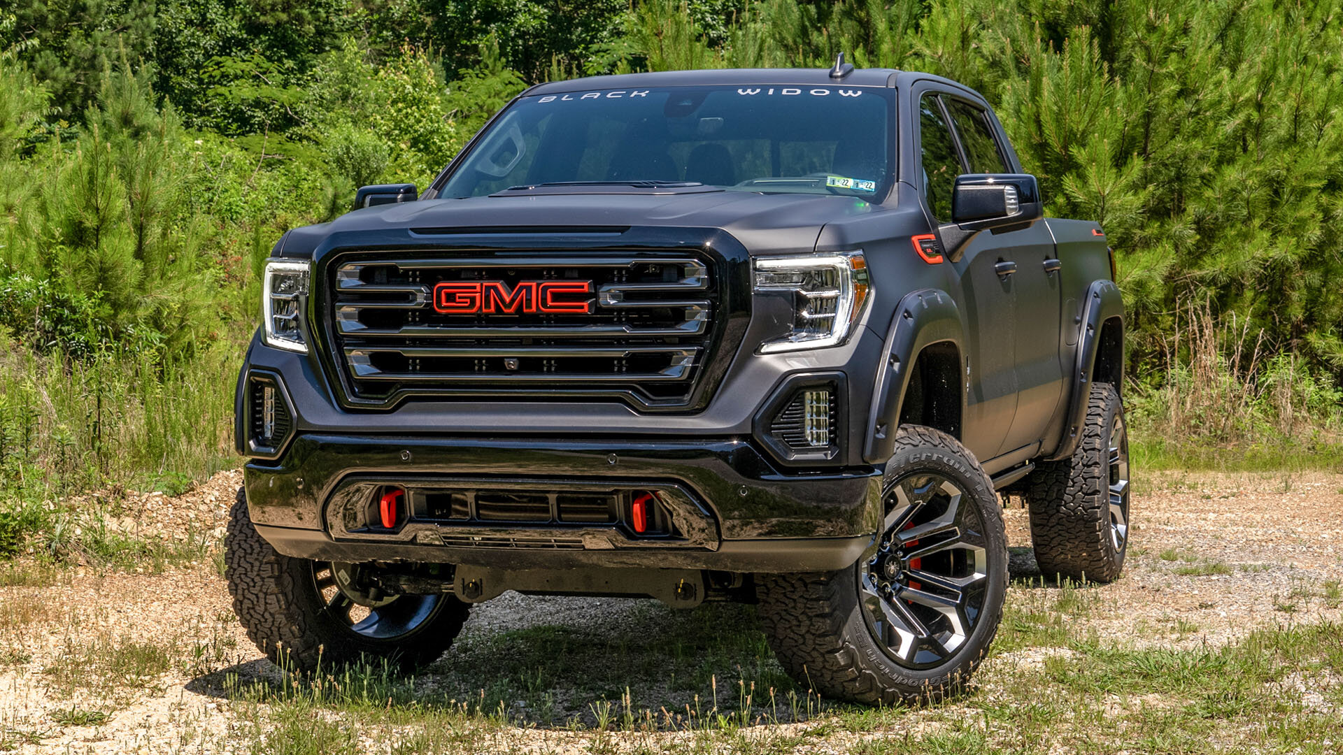 A relevant stock photo of gmc sierra 1500 custom in a typical setting.