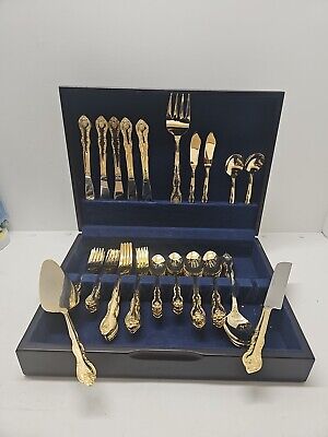 A relevant stock photo of gold plated china in a typical setting.