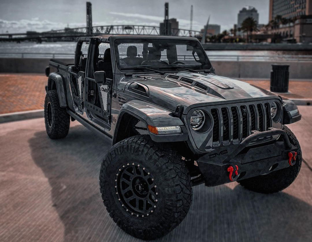 A relevant stock photo of jeep gladiator rubicon custom in a typical setting.