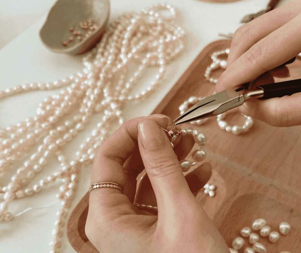 A relevant stock photo of necklace manufacturer in a typical setting.