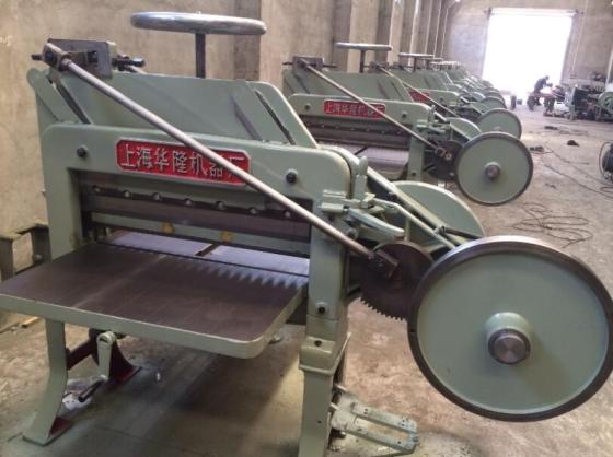 A relevant stock photo of paper cutting machine china in a typical setting.