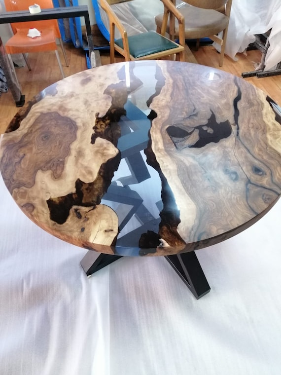 A relevant stock photo of round dining table custom in a typical setting.