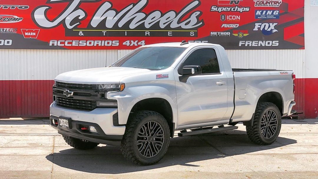 A relevant stock photo of single cab silverado custom in a typical setting.