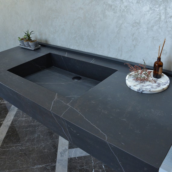 A relevant stock photo of sink custom in a typical setting.