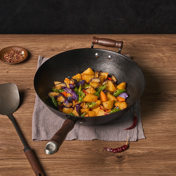 A relevant stock photo of wok china in a typical setting.