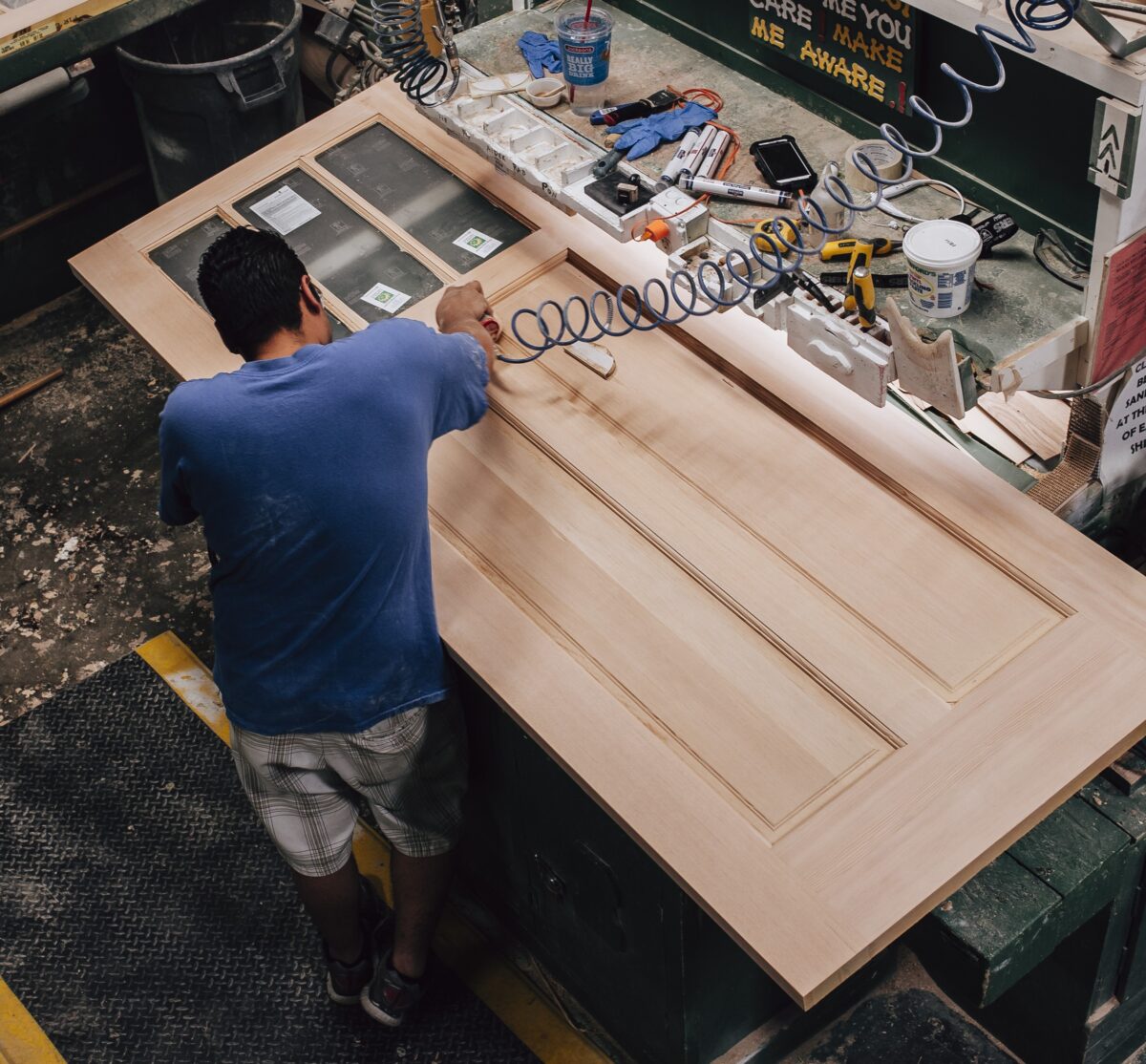A relevant stock photo of wooden door manufacturer in a typical setting.